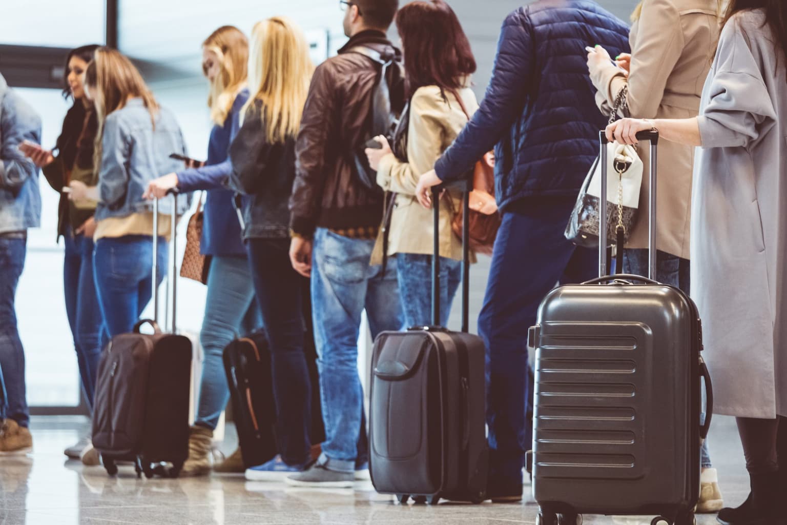 Travellers are now being told ‘don’t bring luggage’ in desperate bid to tackle airport chaos