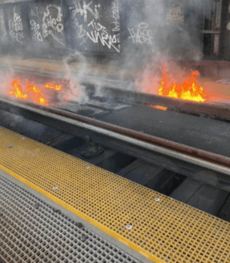 ‘Stray spark’ ignites fire on timber beams blocking major London railway line
