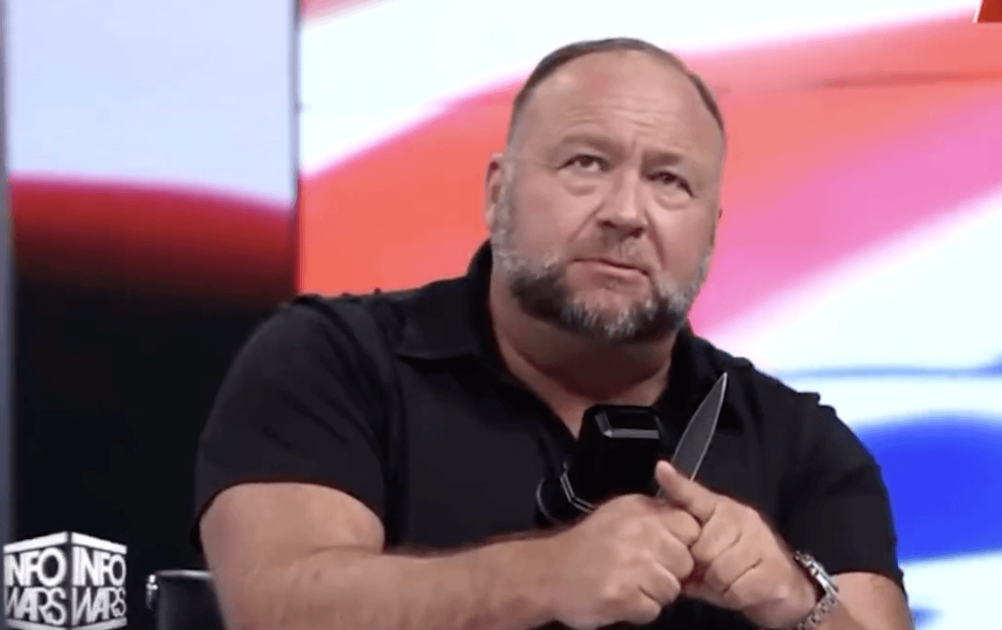 Alex Jones threatens to cut finger off in bizarre attempt to thank Infowars audience