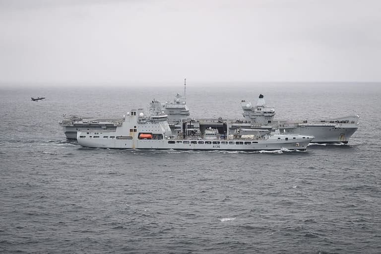Jets scrambled to intercept Russian plane ‘dropping devices’ near UK flagship carrier Jets scrambled to intercept Russian plane ‘dropping devices’ near UK flagship carrier