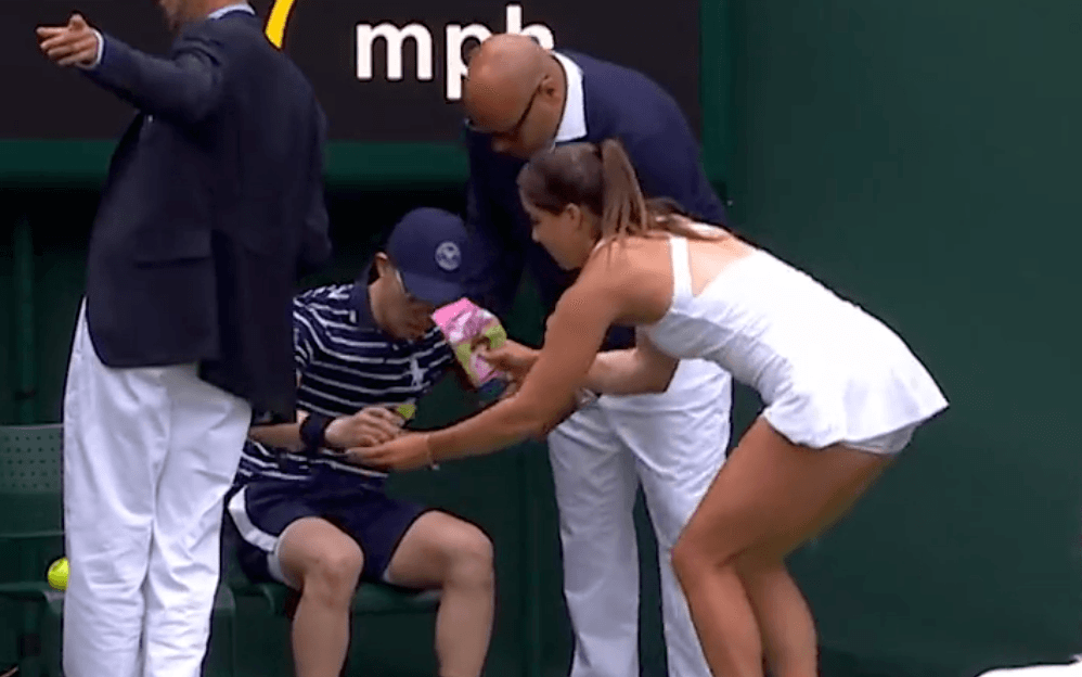 Heartwarming moment Wimbledon match halted as Brit star rushes to ill ball boy – gives him Percy Pigs