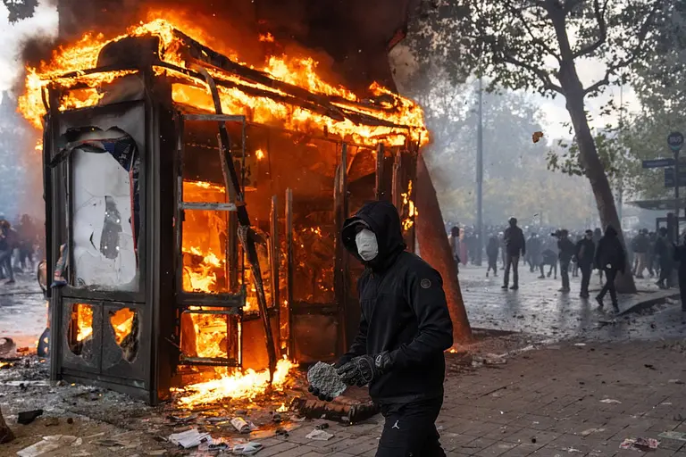 Paris riots leave cars torched and shops looted as 1,800 arrested Paris riots leave cars torched and shops looted as 1,800 arrested