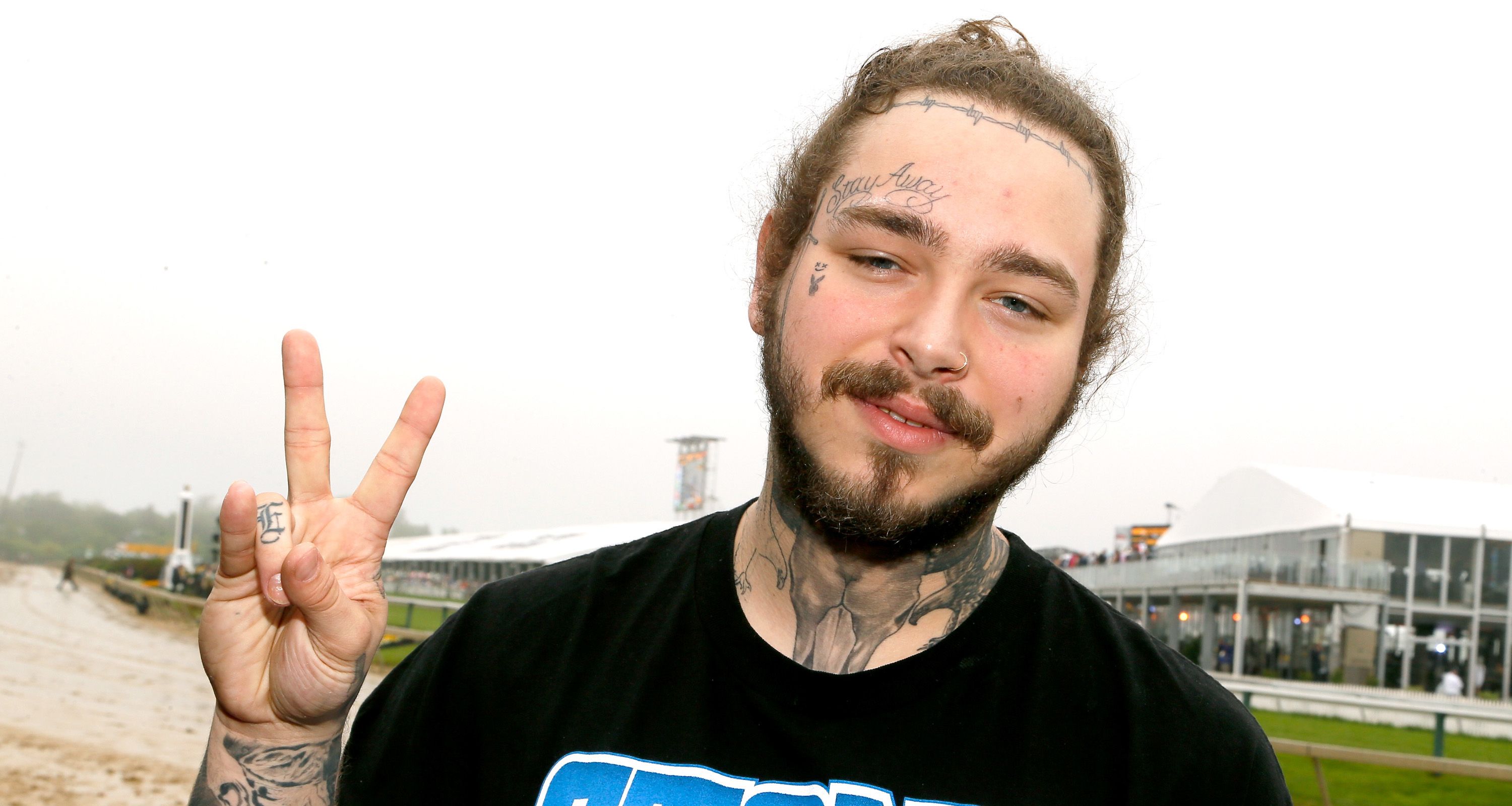 Post Malone gets Always Tired tattooed across his face  JOEcouk