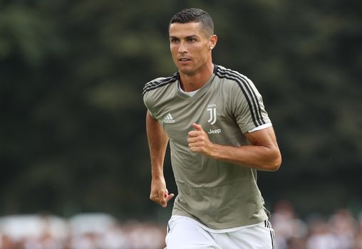 Cristiano Ronaldo of Juventus FC holds a jersey with the number 700 News  Photo - Getty Images