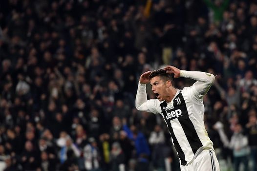 Cristiano Ronaldo of Juventus FC holds a jersey with the number 700 News  Photo - Getty Images